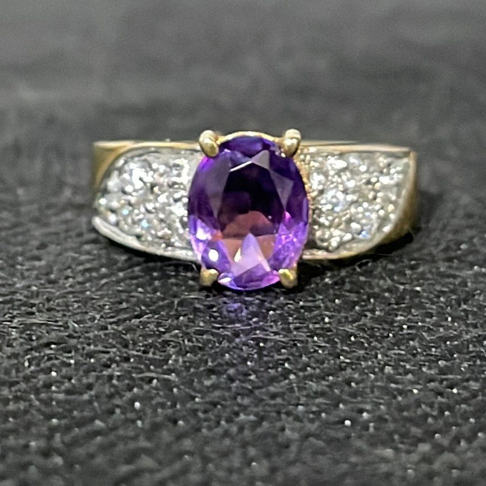 Large ring with a large purple gem